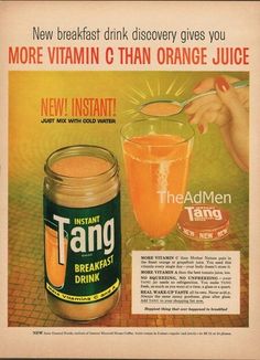 an advertisement for tang orange juice on a table