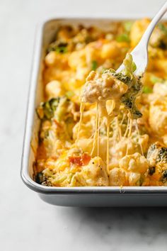 broccoli and cauliflower casserole being lifted with a fork