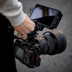 a person holding a camera and recording something