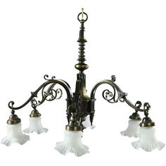 an old fashioned chandelier with five lights