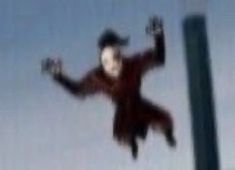 a blurry image of a person jumping in the air