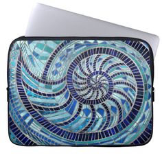 a laptop computer case with a blue mosaic design