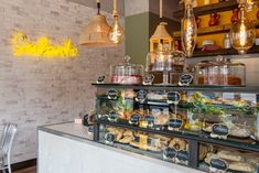 the food is on display in the glass case behind the counter at the restaurant's deli