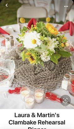 a table with flowers and candles is set up for an outdoor wedding or special event