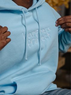 - Heavyweight unisex hoodie with an oversized fit - 70% cotton / 30% polyester premium fleece blend - High quality embroidered logo on front & design printed on back - Brushed interior for ultimate comfort Happiness Project, Mental Health Resources, Better Days, Better Day, Vibrant Design, Kids Hats, Front Design, Kids Accessories, Sky Blue