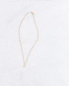 This delicate necklace has a mini hexagon pendant on a cascading chain, creating a floating effective on the neckline. A best seller and a great addition to your minimalist collection, this necklace can be worn two ways: pearl on one side and solid gold on the other. This 14K gold necklace makes a wonderful gift for yourself and others. Details: Dimensions: 16 in chain length, .25in width of hexagon Sterling Silver plated in 14K Gold Nickel free Made in New York City Made by Sophie Blake, her pa Simple Necklace With Initial Pendant And Delicate Chain, Minimalist Charm Necklace With Initial Pendant, Minimalist Initial Pendant Charm Necklace With Delicate Chain, Simple 14k Gold Necklace With Adjustable Chain, Minimalist 14k Gold Pendant Chain Necklace, Minimalist Everyday Initial Pendant Necklace, Minimalist Long Necklace With Pearl Pendant, Minimalist Jewelry With Delicate Chain And Initial Pendant, Minimalist Initial Necklace With Delicate Chain