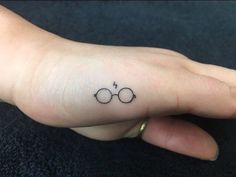 a hand with a small harry potter symbol on it