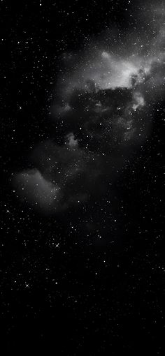 the night sky is filled with stars and clouds, as if it were in black and white