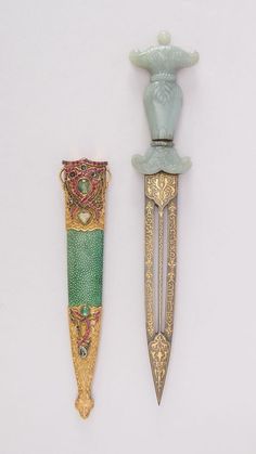 two decorative items are displayed on a white surface, one is green and the other is gold