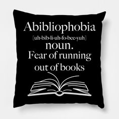 a pillow with an open book on it that says, abililophobia