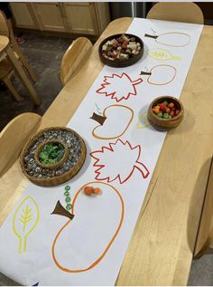 a long table with some bowls and food on it