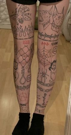 a person with tattoos on their legs