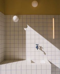 an overhead view of a bathroom with tiled walls