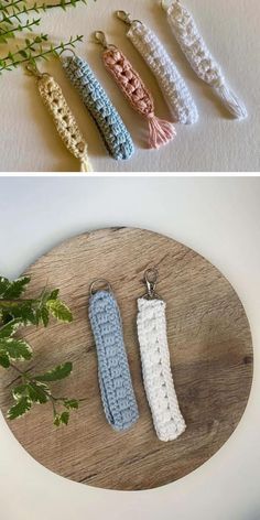 crocheted key fobs are displayed on a wooden board next to plants