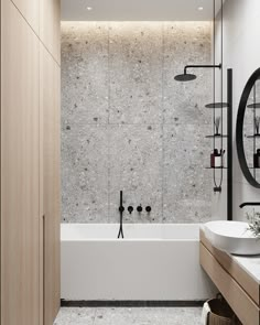 a bathroom with a sink, mirror and bathtub next to a wall mounted shower head