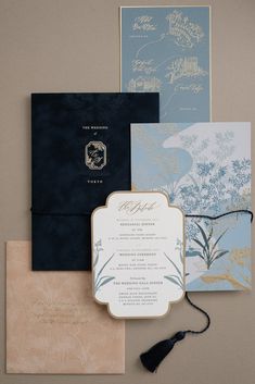 the wedding stationery is laid out on top of each other