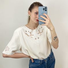 - Vintage white short sleeve blouse with embroidery - 100% polyester - Excellent condition - Tag size 40, fits many, please see measurements Measurements (laying flat): Shoulders: 43 cm / 16.9 inches  Armpit to armpit: 54 cm / 21.3 inches  Length: 70 cm / 27.6 inches SHIPPING INFO: Shipping price in the listing is for the "Standard Latvian post shipping". Includes tracking info and takes: * 5 business days within European Union * 10-15 business days to United States and Canada * Up to 1 month to Elegant White Embroidered Short Sleeve Top, Cream Short Sleeve Tops With Floral Embroidery, Cream Short Sleeve Blouse For Summer, Cream Embroidered Short Sleeve Blouse, White Embroidered Short Sleeve Top, Vintage Floral Embroidered Short Sleeve Top, Vintage White Short Sleeve Blouse, Cottagecore Blouse, White Embroidered Blouse