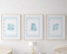 three framed pictures hang on the wall above a crib