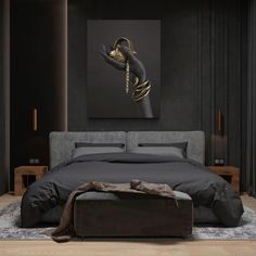 a bedroom with black walls and wooden flooring has a large painting on the wall