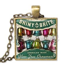 shiny brite glass christmas ornaments in a box on a chain