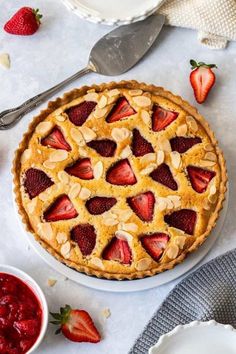 a strawberry almond pie on a white plate