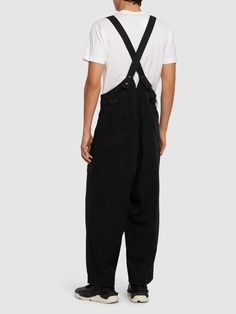 Find Y3 Tech Suspender Pants on Editorialist. Adjustable suspender straps. Front button and concealed zip closure. One front cargo pocket. Model is wearing a sizeM Utility Overalls With Side Pockets For Streetwear, Black Utility Overalls With Side Pockets, Black Overalls With Pockets For Streetwear, Black Workwear Bottoms With Suspenders, Baggy Utility Overalls With Side Pockets, Utility Overalls With Side Pockets And Loose Fit, Cotton Bottoms With Adjustable Straps For Workwear, Utility Cargo Overalls, Baggy Utility Overalls