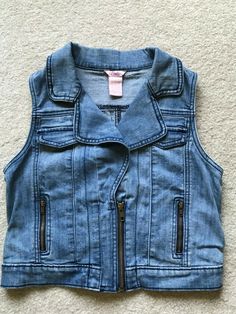 This is a USED Girls Candie’s Blue Denim Sleeveless Vest Two Faux top pockets Two zippered front side pockets Size M(10/12) Excellent Used Condition See the pictures for specific details. Ask any questions prior to bidding.  I do my best to accurately describe the item. Comes from a pet free and non-smoking home. Thanks for looking!  Be sure to take a look at the other items that we have listed.  New items are added regularly. Zoo Zoo, Sewing Christmas, Girls Vest, Girls Denim, Sleeveless Vest, Girls Jacket, Denim Vest, New Items, Blue Denim