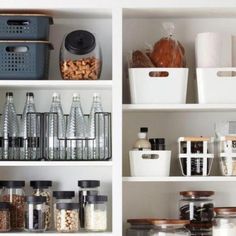 an organized pantry with white shelves and clear bins