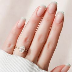 a woman's hand with a ring on it