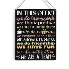 a sign that says in this office we do teamwork