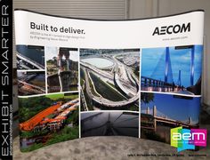 an advertisement for the aecom built to deliver, with images of bridges and roads