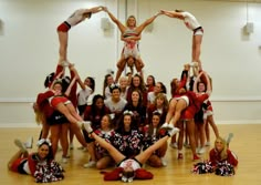 a group of cheerleaders are posing for a photo