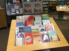 there are many books on this table in the library