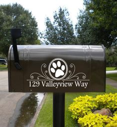 a mailbox with a dog's paw painted on it