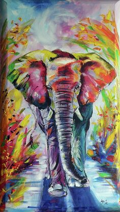 an elephant is walking down the street with colorful paint