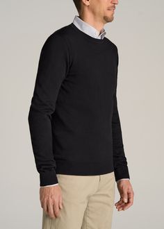 About Our Sweaters for Tall Men This tall men's sweater is as comfy as your favorite crewneck but with a more polished look that you can wear out of the house. When you're shopping for sweaters for tall men, you want options that are as comfortable as they are stylish. That's where we come in. We created this crewneck to look as classy on the outside as it is cozy on the inside. It's been designed exclusively for guys over 6'3”, with extra-long sleeves that will go all the way past your wrists a Black Crew Neck Sweater For Fall, Fall Black Sweater For Business Casual, Black Sweater For Business Casual In Fall, Black Crew Neck Sweater For Work, Black Business Casual Sweater For Winter, Black Business Casual Winter Sweater, Black Crew Neck Sweater With Ribbed Collar, Black Long Sleeve Business Casual Sweater, Black Casual Business Sweater