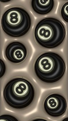 an image of some black and white circles with the number eight on them, as well as