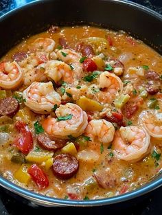 a pan filled with shrimp and sausage soup