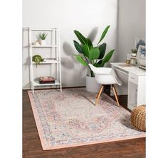 a room with a rug, chair and potted plant