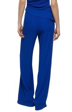 Make your next office ensemble pop in these beautifully textured pants flaunting kicky wide legs. Elastic waist 96% polyester, 4% elastane Machine wash, line dry Imported Blue Wide-leg Pants With 4-way Stretch, Blue Versatile 4-way Stretch Pants, Versatile Blue 4-way Stretch Pants, Blue Wide Leg Elastane Pants, Textured Pants, Wide Legs, Medium Blue, Leg Pants, Wide Leg Pants