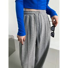 : Elevate your casual wardrobe with our Soft Glutinous Air Layer Sports Pants, designed to blend comfort with style seamlessly. These loose, wide-leg trousers offer a relaxed fit while maintaining a chic and modern look.The soft air layer fabric ensures a gentle touch against your skin, making these pants perfect for everyday wear. The elastic waistband adds an extra level of comfort, allowing for easy movement while providing a flattering fit. Whether you're running errands, hitting the gym, or lounging at home, these pants are your go-to choice.The drooping wide leg design adds a contemporary flair to the casual aesthetic, making a subtle yet stylish statement. Embrace the versatility of these trousers, pairing them effortlessly with your favorite sneakers or sandals for a laid-back vibe Pant Trousers Women, Trousers Women Wide Leg, Fairy Dresses, Wide Leg Sweatpants, Pants Loose, Sports Pants, Casual Design, Soft Air, Casual Lace