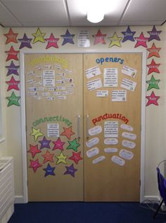 an office door decorated with colorful stars and writing on the doors, as well as bulletins