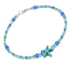 Starfish anklet.  Beautiful matte glass beads that mimic the colors of sea glass and multi color 3mm faceted glass beads in colors of blue and green, and crystal accents.  A magnesite starfish is the focal bead.  All metal is Sterling silver.  Strung on sturdy nylon coated beading wire.   Many sizes are available included 9 - 10 - 11 - 12 inches and sizes in between!  Small size or plus size. A great beachy anklet for a coastal gift! A pouch and gift box is included. Blue Beaded Starfish Anklet, Beachy Anklets, Starfish Anklets, Beachy Jewelry, Ankle Bracelet, Beading Wire, Anklet Jewelry, Faceted Glass, Bracelet For Women