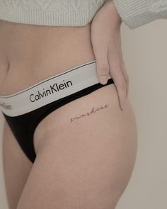 a woman's stomach with the word someone written on it and her name in cursive writing