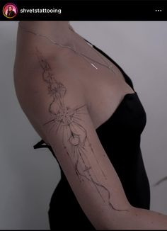 a woman with a tattoo on her arm