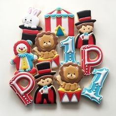 decorated cookies are arranged in the shape of numbers and circus themed animals, including an elephant