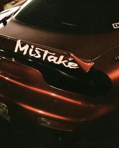 a close up of a car with the word mistake on it's side