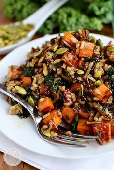 a white plate topped with rice and vegetables