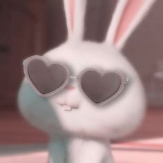 a white rabbit wearing heart shaped sunglasses