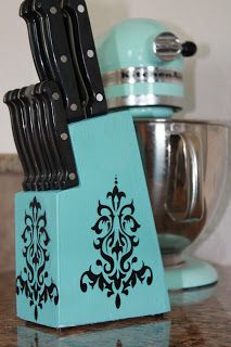 a blue block with black damask on it and a mixer in the back ground